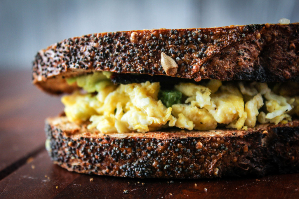 jacked up egg sandwich on table