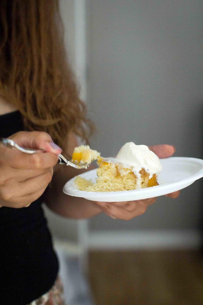 Summer Peach Upside Cake -- slice with ice cream in hand -- bakesinslippers.com_