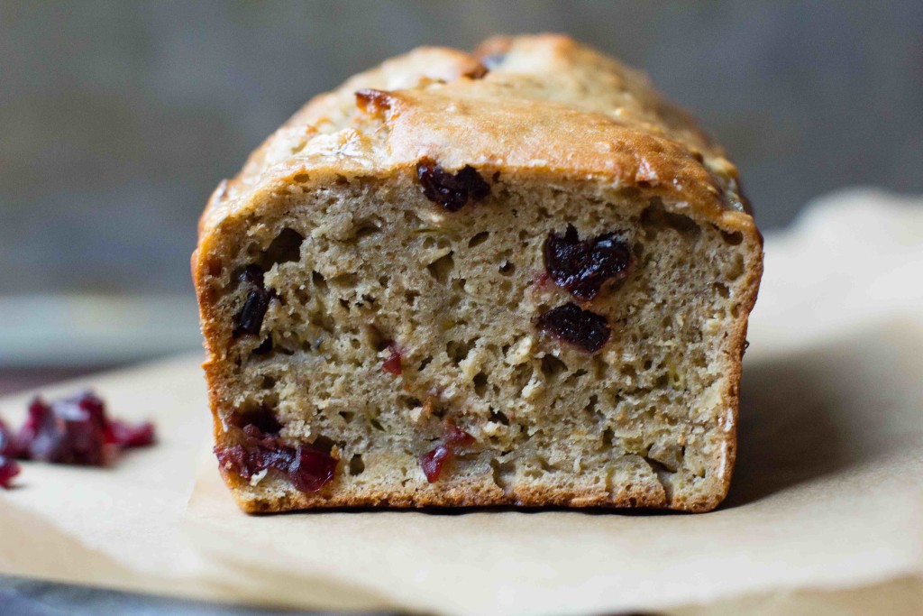 One Bowl Cranberry Oat Banana Bread sliced || bakesinslippers.com