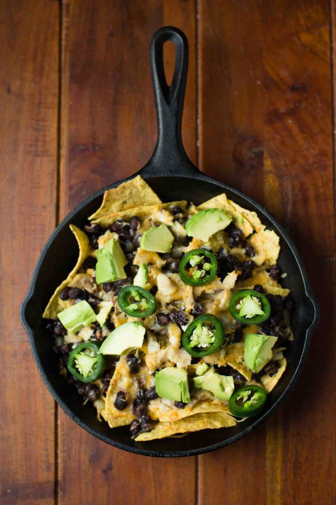 Cast Iron Chicken and Black Bean Nachos with jalapenos and avocado* || bakesinslippers.com