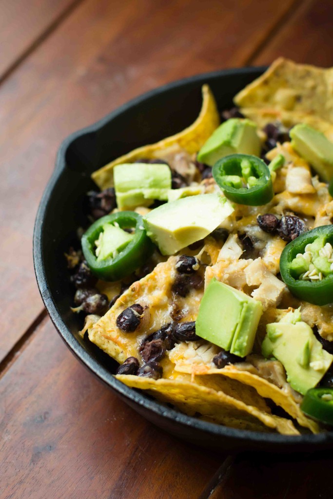 Cast Iron Chicken and Black Bean Nachos with jalapenos and avocado || bakesinslippers.com
